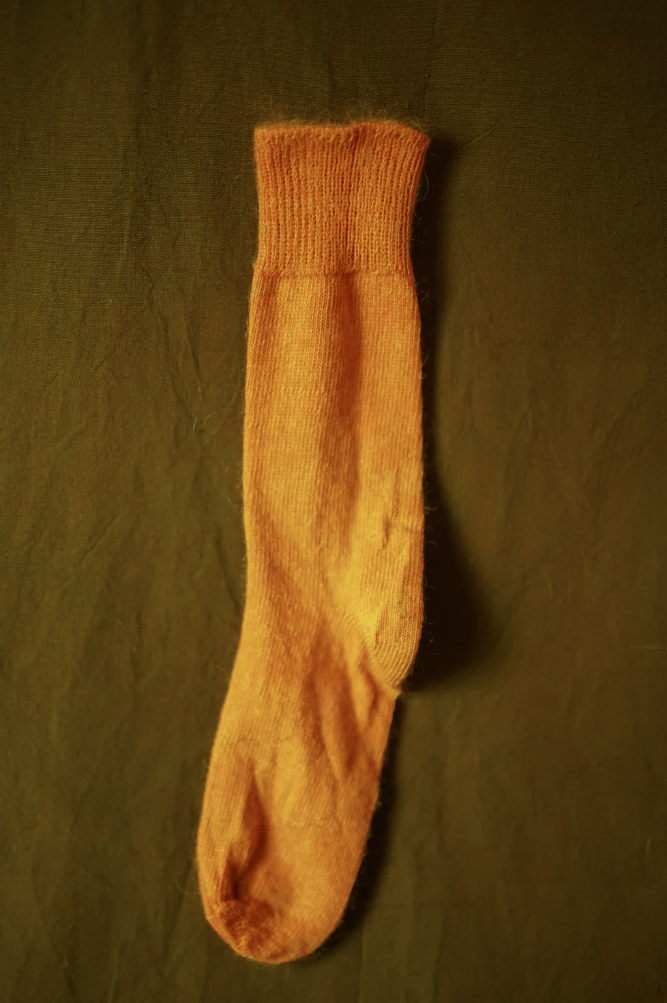 Women’s mohair calf length socks in marigold yellow, shown laid flat, designed to wear with leather boots for warmth and comfort.