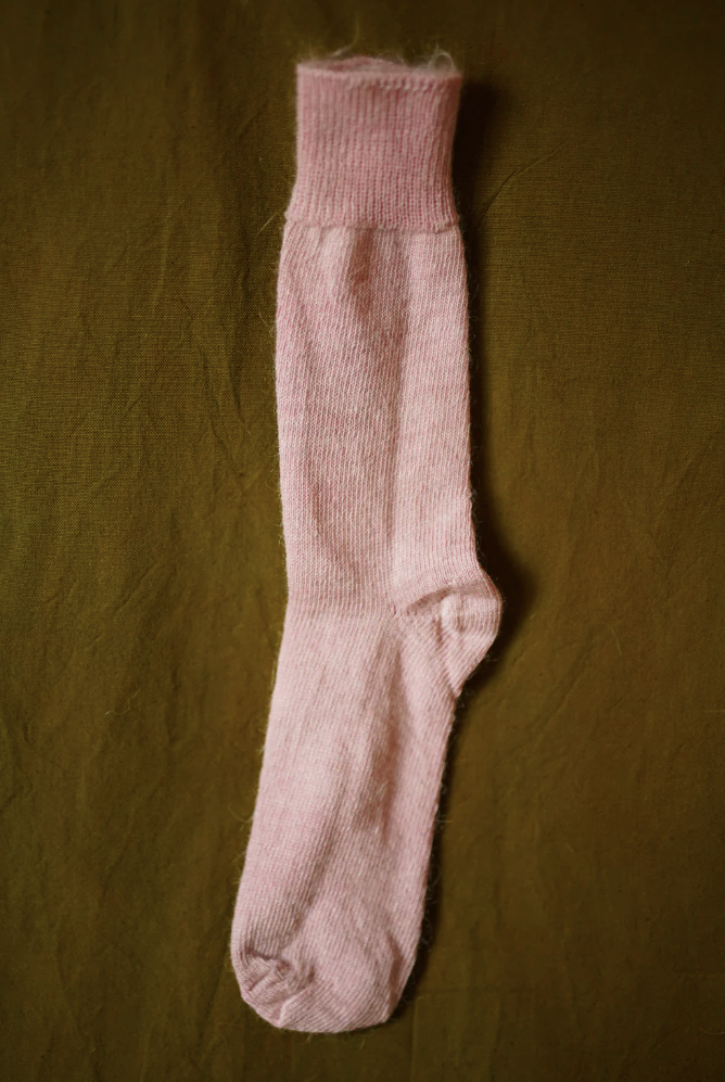 Women’s mohair calf length socks in light pink, shown laid flat, designed to wear with leather boots for warmth and comfort.