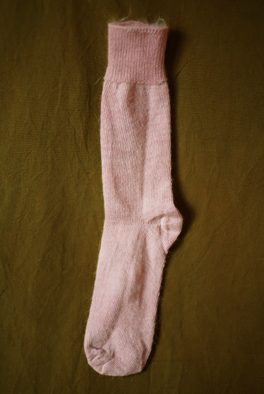 Women’s mohair calf length socks in light pink, shown laid flat, designed to wear with leather boots for warmth and comfort.